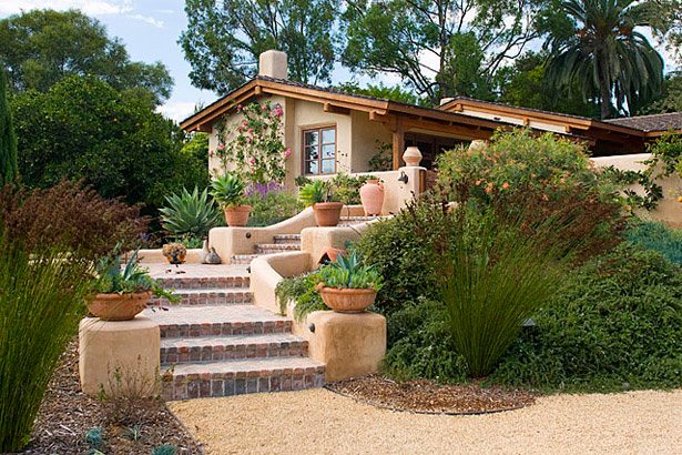 Terraced stucco garden steps with potted succulents